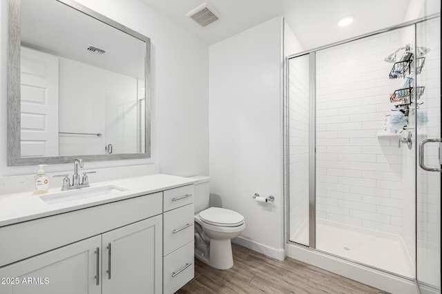 4077 S Sabrina Dr Unit 14, Chandler, AZ 85248 - full bath featuring visible vents, toilet, a stall shower, and wood finished floors