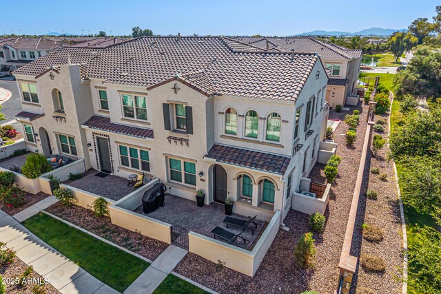 4077 S Sabrina Dr Unit 14, Chandler, AZ 85248 - rear view of property with a fenced front yard, a tiled roof, a residential view, and stucco siding