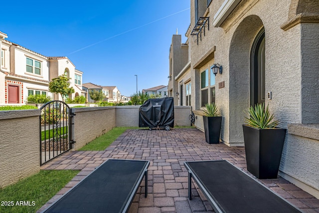 4077 S Sabrina Dr Unit 14, Chandler, AZ 85248 - view of patio / terrace with fence, a residential view, a gate, and area for grilling