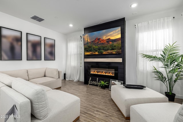 4077 S Sabrina Dr Unit 14, Chandler, AZ 85248 - living area featuring a fireplace, recessed lighting, visible vents, and wood finished floors
