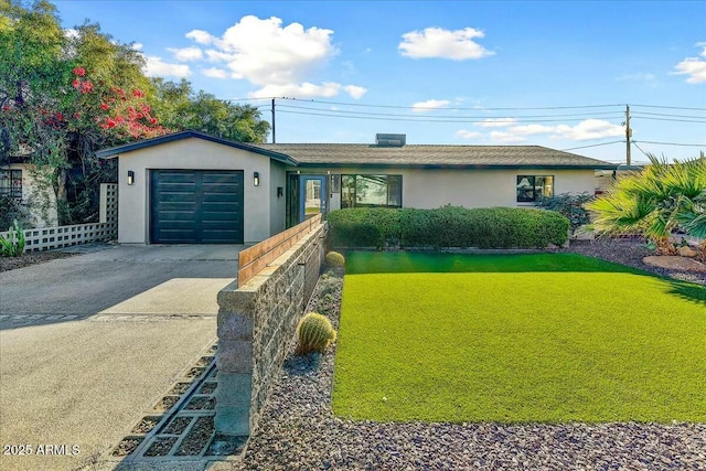 single story home featuring stucco siding, a front yard, fence, a garage, and driveway