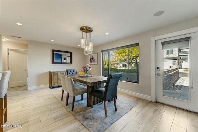 dining area with light wood-type flooring, visible vents, baseboards, and recessed lighting