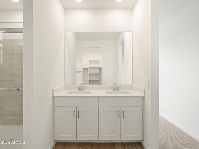 bathroom featuring vanity and walk in shower