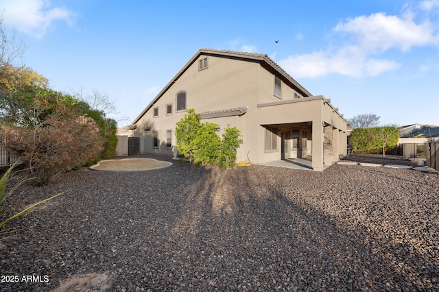 back of property featuring a patio