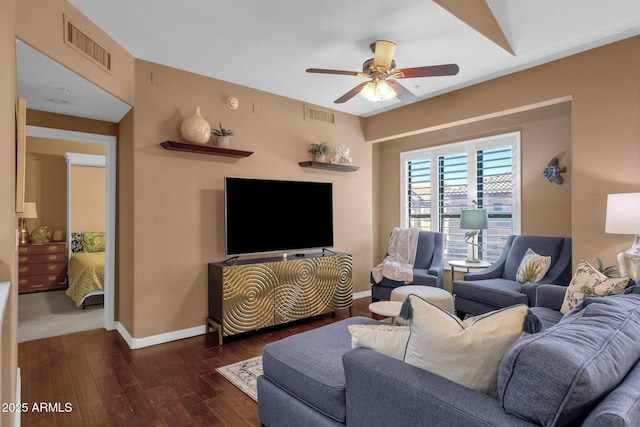 living room featuring dark hardwood / wood-style floors and ceiling fan