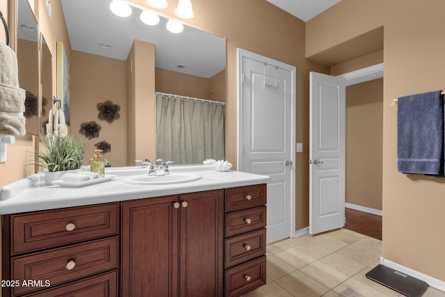 bathroom featuring tile patterned flooring and vanity