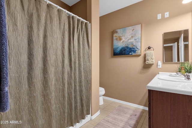 bathroom featuring vanity, toilet, and tile patterned flooring