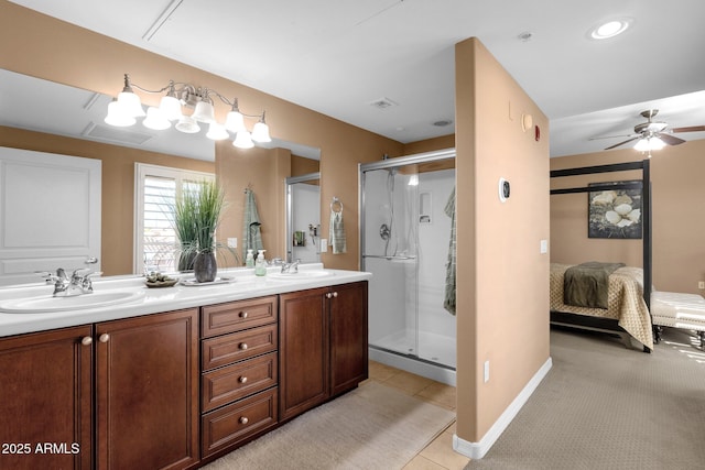 bathroom featuring tile patterned flooring, vanity, an enclosed shower, and ceiling fan