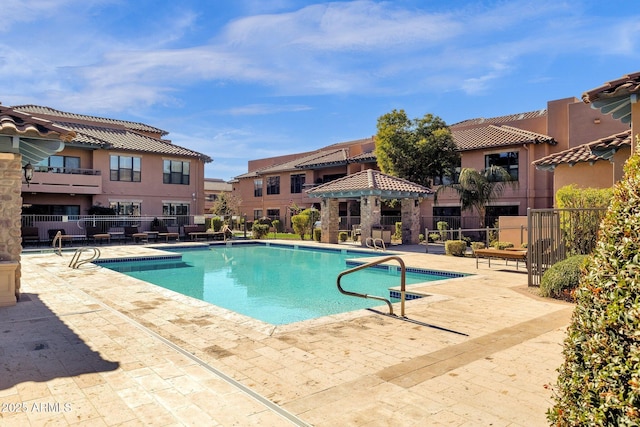 view of swimming pool featuring a gazebo and a patio area