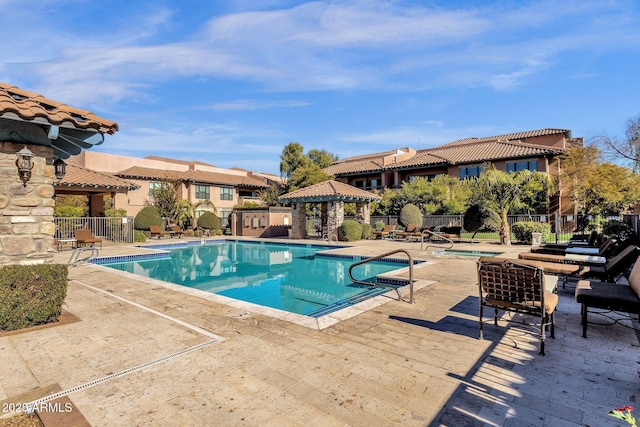 view of swimming pool featuring a gazebo and a patio