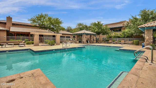 view of swimming pool featuring a gazebo and a patio area