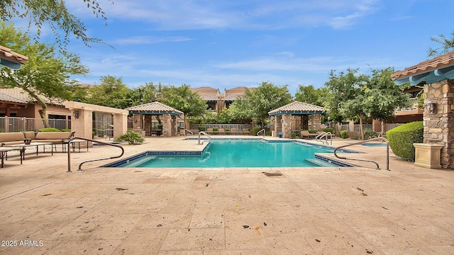 view of swimming pool featuring a gazebo and a patio area