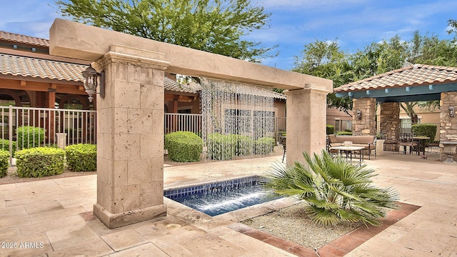 exterior space featuring a gazebo and an outdoor hangout area