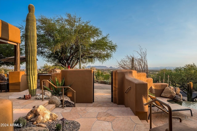 view of patio / terrace with a mountain view