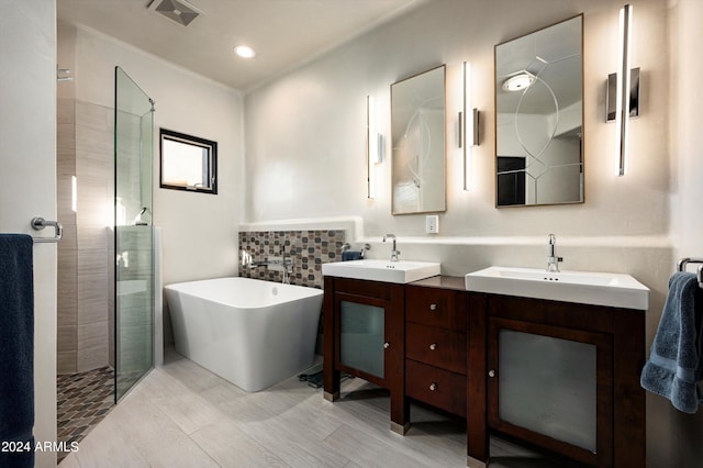 bathroom featuring vanity, plus walk in shower, and tile walls