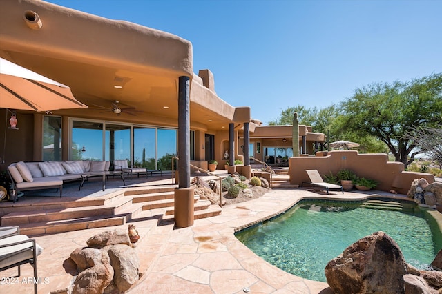 view of swimming pool with a patio, ceiling fan, and outdoor lounge area