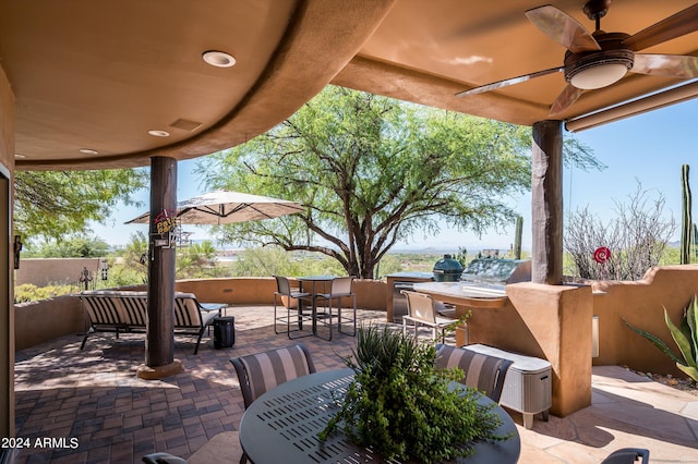 view of patio / terrace featuring ceiling fan