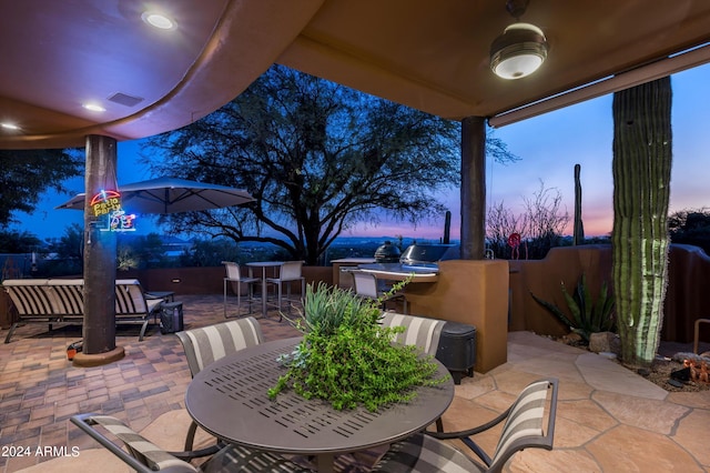 patio terrace at dusk with outdoor lounge area