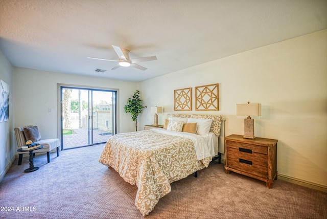 carpeted bedroom featuring ceiling fan and access to outside