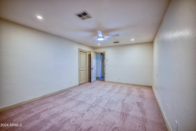 empty room with light carpet and ceiling fan