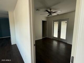 interior space with ceiling fan, dark hardwood / wood-style flooring, and french doors