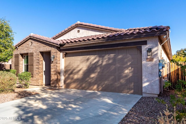 mediterranean / spanish-style home with a garage