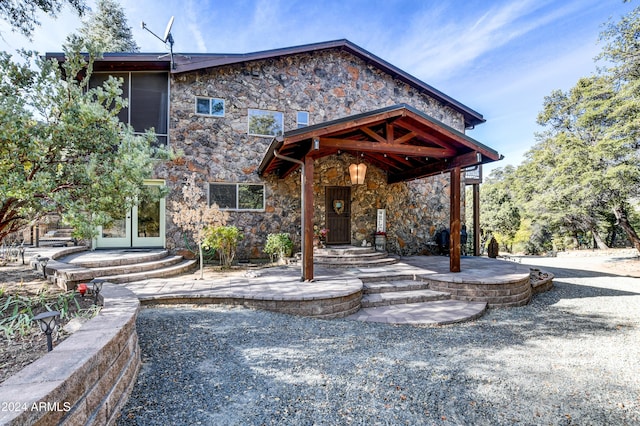 view of front of property featuring french doors and a patio