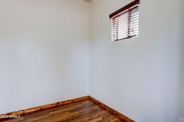 spare room featuring hardwood / wood-style floors