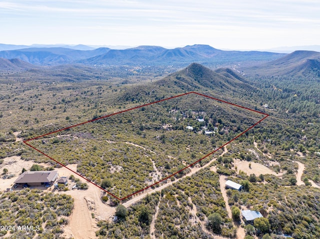 drone / aerial view featuring a mountain view