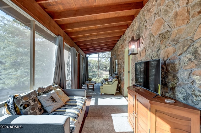 sunroom featuring vaulted ceiling with beams and wooden ceiling