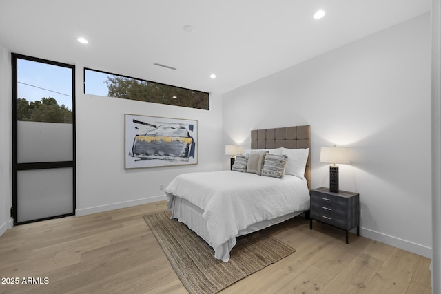 bedroom featuring recessed lighting, light wood-style floors, visible vents, and baseboards