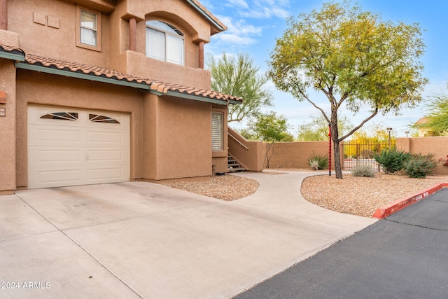 view of side of home with a garage