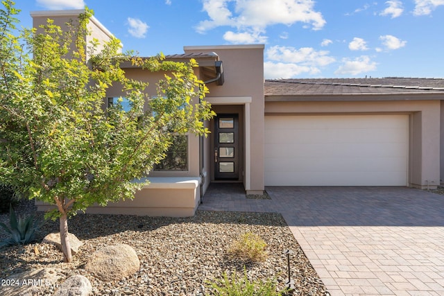 entrance to property featuring a garage