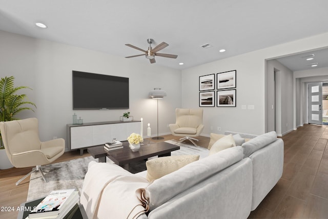 living room with hardwood / wood-style floors and ceiling fan