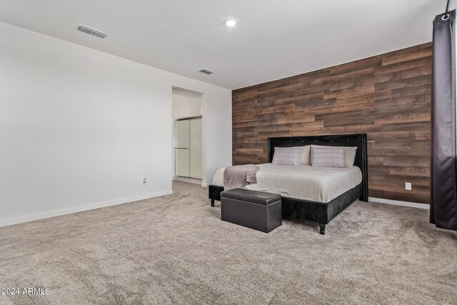 carpeted bedroom with wooden walls