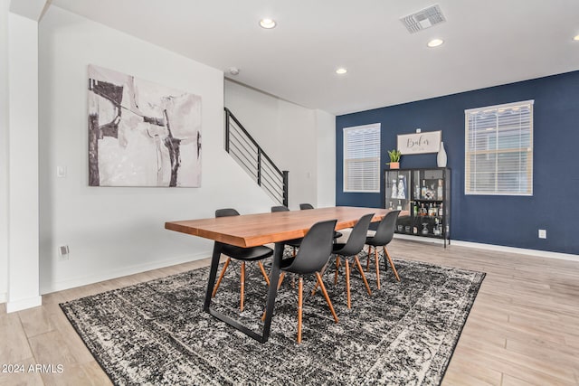 dining space with light hardwood / wood-style floors