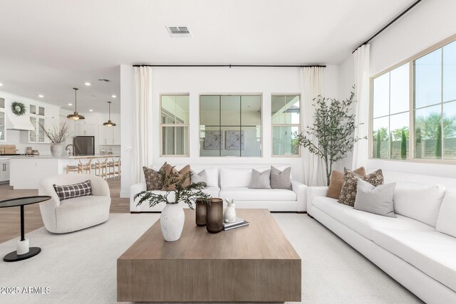 1248 E Jude Ln, Gilbert, AZ 85298 - living area featuring healthy amount of natural light and recessed lighting