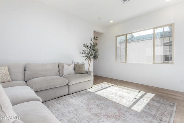 1248 E Jude Ln, Gilbert, AZ 85298 - living room featuring wood finished floors, recessed lighting, and baseboards