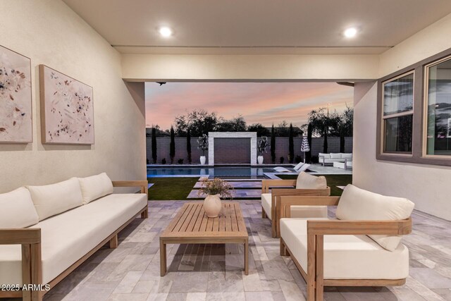 1248 E Jude Ln, Gilbert, AZ 85298 - patio terrace at dusk featuring an outdoor living space, a patio area, and a fenced backyard