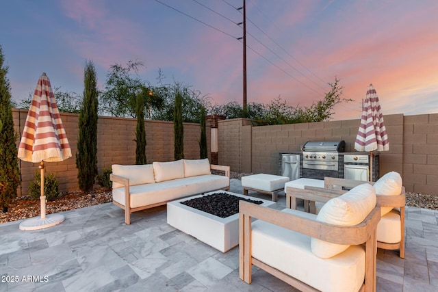 1248 E Jude Ln, Gilbert, AZ 85298 - patio terrace at dusk featuring an outdoor living space, a patio, and a fenced backyard