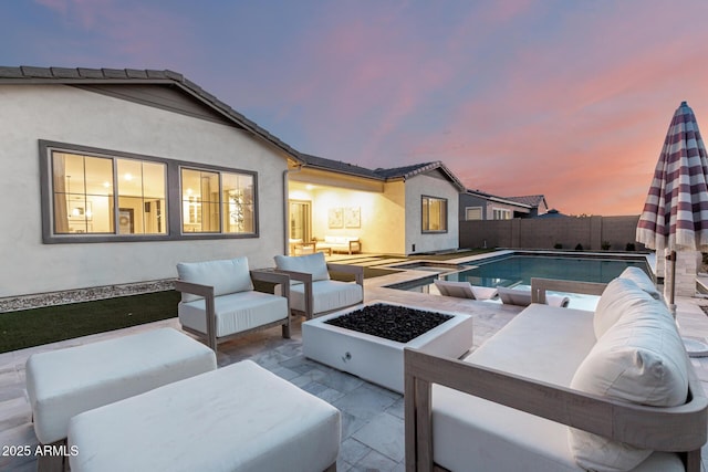 1248 E Jude Ln, Gilbert, AZ 85298 - pool at dusk featuring outdoor lounge area, a patio, and a fenced backyard