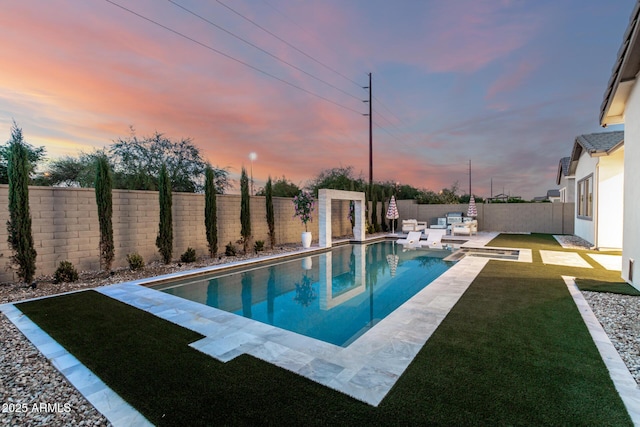 1248 E Jude Ln, Gilbert, AZ 85298 - pool at dusk with outdoor lounge area and a patio area