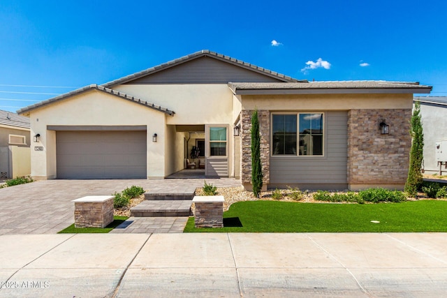 1248 E Jude Ln, Gilbert, AZ 85298 - view of front of property with a garage, decorative driveway, stucco siding, a front lawn, and a tile roof