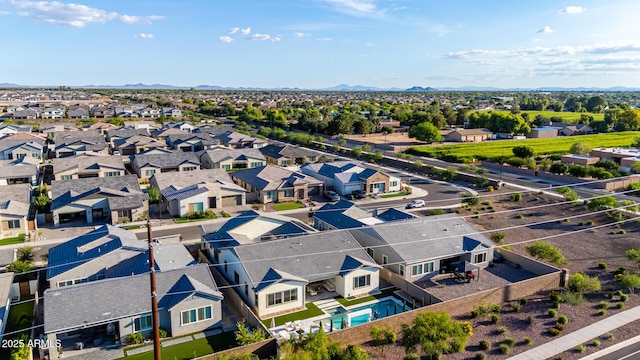 1248 E Jude Ln, Gilbert, AZ 85298 - aerial perspective of suburban area featuring a pool area and a mountainous background