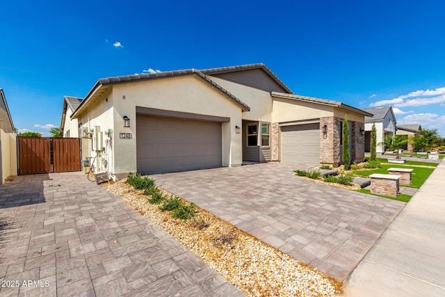 1248 E Jude Ln, Gilbert, AZ 85298 - single story home featuring an attached garage, a gate, stucco siding, and decorative driveway