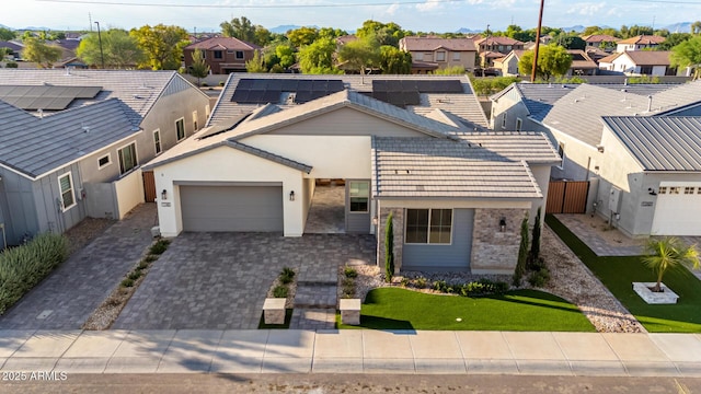 1248 E Jude Ln, Gilbert, AZ 85298 - view of front of property featuring a residential view, an attached garage, decorative driveway, solar panels, and stucco siding