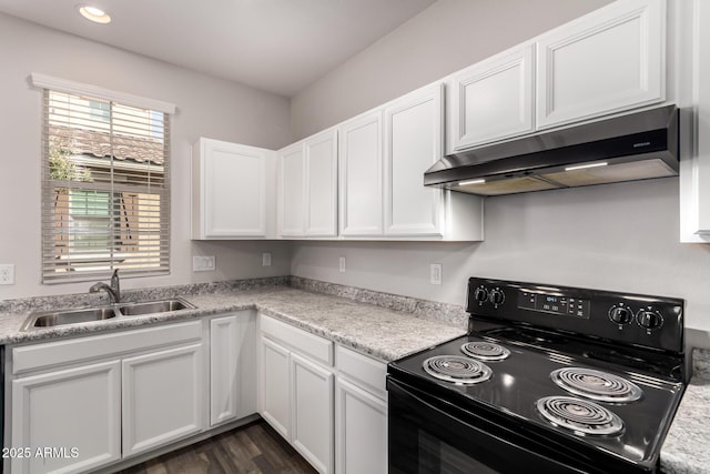 kitchen featuring white cabinetry, sink, and electric range