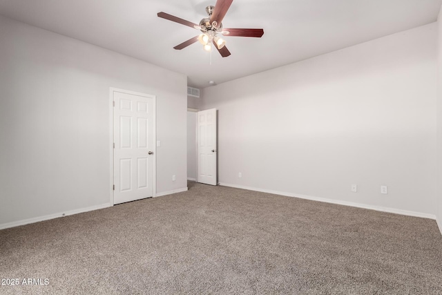 carpeted spare room with ceiling fan