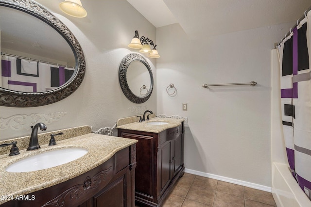 bathroom with shower / bath combo, vanity, and tile patterned floors