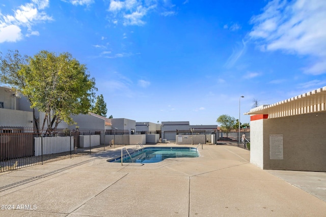 view of swimming pool featuring a patio area